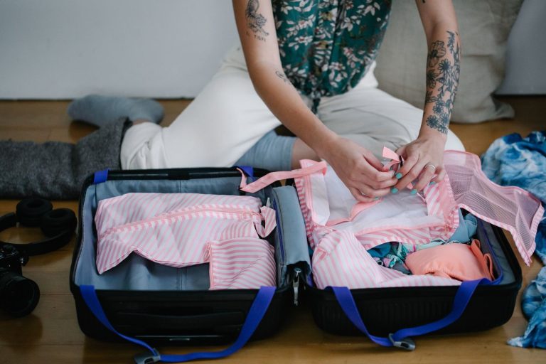 A curated selection of essential bras neatly arranged inside an open travel suitcase.